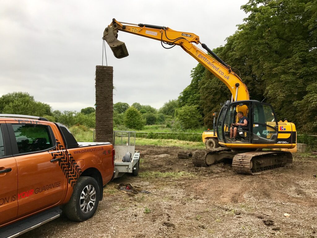 jcb with it's new tracks ready to be fitted on site