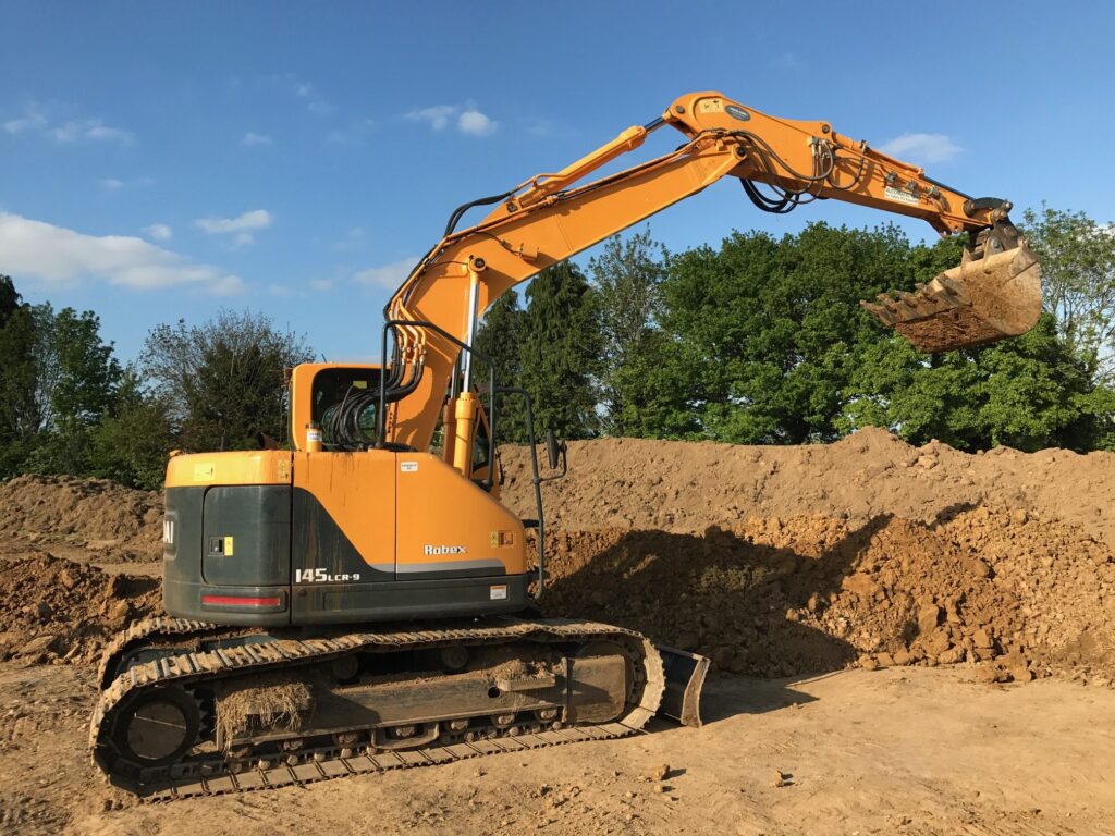 Hyundai 145 excavator working on site