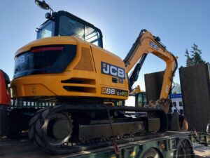 jcb 86c excavator on low loader at jay bee plant sales